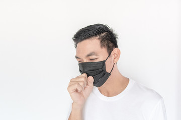 Portrait of young Asian Man wearing mask protect fine dust in air pollution environment