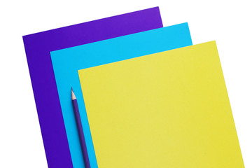 blue, cyan and yellow sheets of paper and pencil, copy space