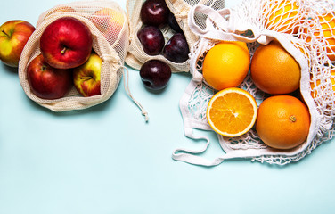 Mesh shopping bags with fruits