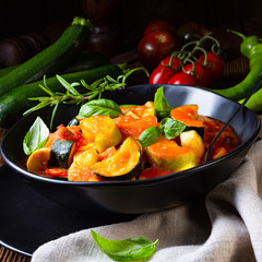 zucchini vegetarian ratatouille with tomato sauce and herbs