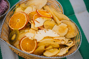 fruit chips in a basket. Homemade sweets. Family picnic