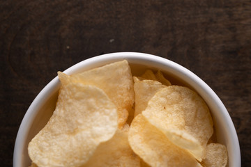 Potato chips heaping in a bowl