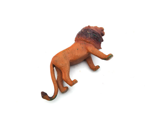 a plastic lion toy isolated on white background