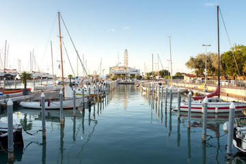 View on mooring of sail boats in sea harbor. Sailboats moored in pier