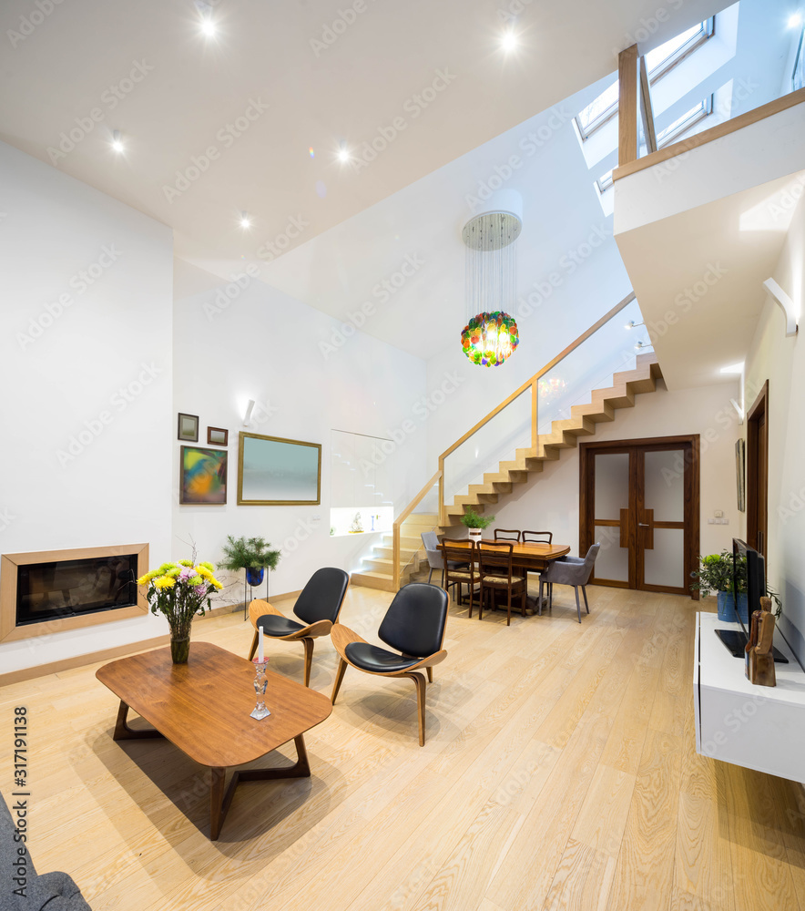 Wall mural light interior of room in private house. entrance door. staircase. fireplace. tables and chairs.