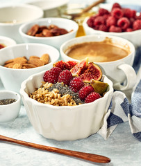 Oatmeal porridge with raspberry and figs in a bowl