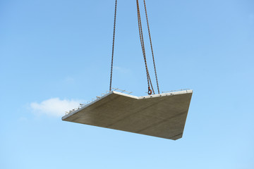 Precast Floor Slab flies through the air in front of bue sky