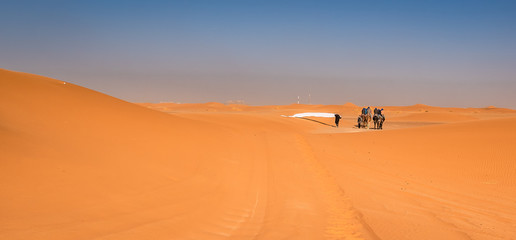 Fototapeta na wymiar People on dunes