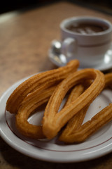 cup of hot chocolate with churros