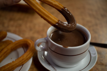 cup of hot chocolate with churros