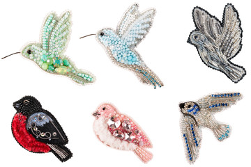 Brooch made of handmade colored beads on the background