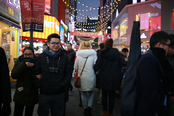 SEOUL, SOUTH KOREA - JANUARY 02, 2020 : Crowds enjoy the Myeongdong Night Market in Seoul.