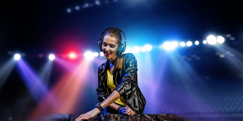 Obraz na płótnie Canvas Female dj in nightclub. Mixed media