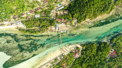 droneshot of yellow bridge over the sea