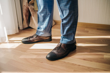 Men's shoes on the legs. Background for business card.