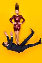 Obraz premium Top above high angle view full length photo of two people married students super joy woman fight air kick legs spouse fall down wear red dress tux high-heels lay isolated yellow color background