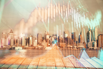 Forex graph on city view with skyscrapers background multi exposure. Financial analysis concept.