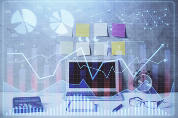 Double exposure of forex graph and work space with computer. Concept of international online trading.