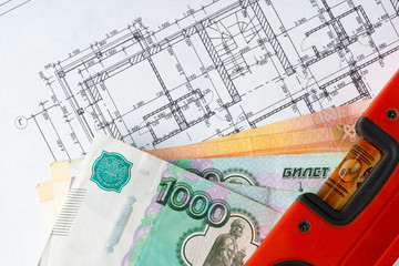 Architectural drawing and Russian Ruble money stack