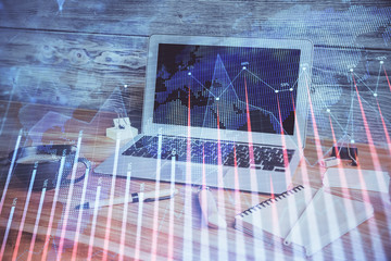 Double exposure of forex chart and work space with computer. Concept of international online trading.