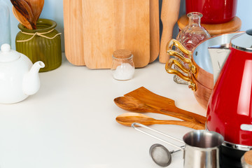 Kitchen utensils on a modern home kitchen table top