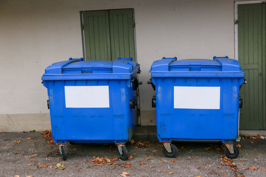 Row of old white, green and colorful trash bin in the community in Germany