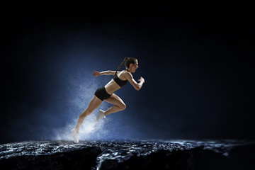 Obraz na płótnie Canvas Sportswoman run race. Mixed media