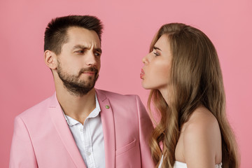 beautiful couple in love have fun on st valentines day. man and woman on pink background