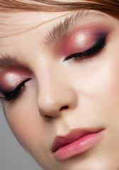 Beautiful woman face close up portrait studio on white.