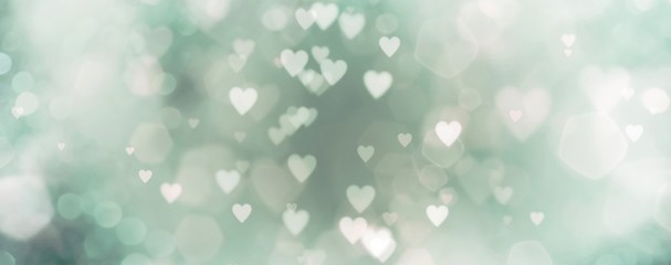 abstract background with bokeh and green hearts