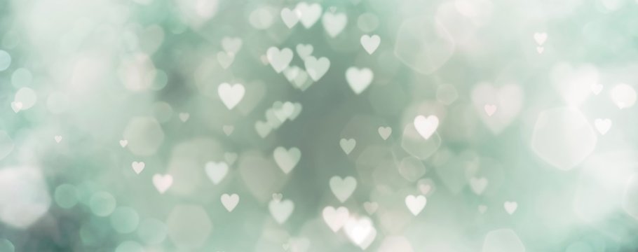 abstract background with bokeh and green hearts