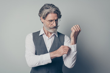 Photo of aged business man macho boss serious look buttoning fixing sleeve preparing meeting wear specs office white shirt waistcoat isolated grey color background