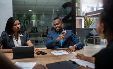 Black African businessman business strategy meeting in modern coworking workspace