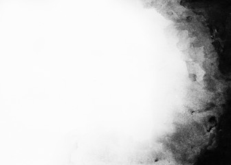 Abstract black watercolor paint on white paper background