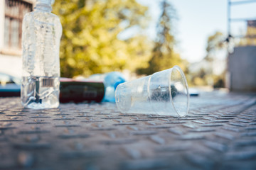 Plastic waste on the floor in aftermath of a party