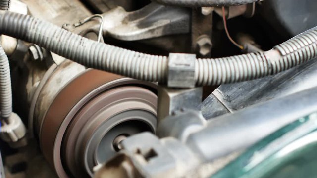 Close up of the old car engine is working. 