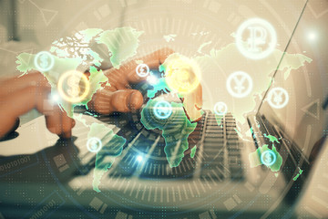 Double exposure of market chart with man working on computer on background. Concept of financial...