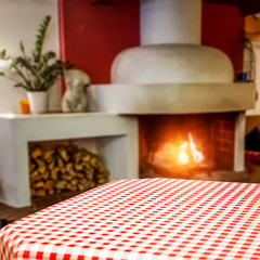 Desk of free space and home interior with fireplace 