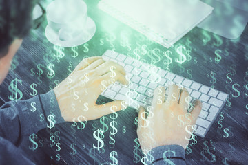 Double exposure of graph with man typing on computer in office on background. Concept of hard work.