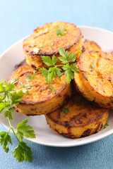 fried polenta  with parsley in plate