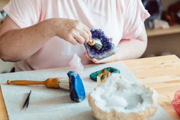 Woman brushing an amethyst