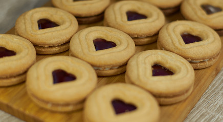 .Tasty fresh cookies on a wooden board