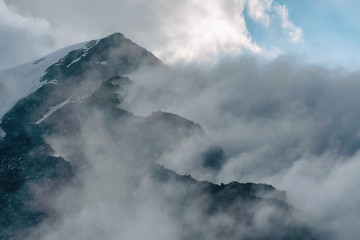 Dramatic cloudy high mountain landscape.