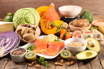 healthy food selection- salmon, avocado, cabbage, fruit and vegetable