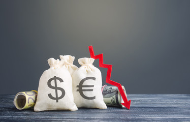Money bags and red down arrow. Economic difficulties fall. Costs and expenses. Loss money savings....