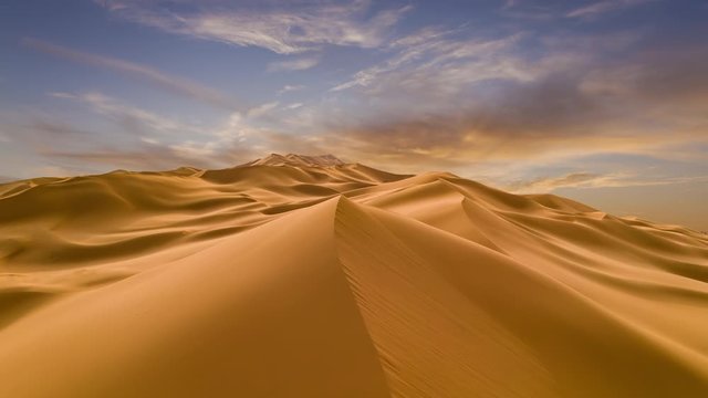 Sunset over the sand dunes in the desert. TimeLapse