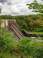 Fototapeta na wymiar The Washburn Dam at the Thruscross Reservoir near Bolton Abbey, North Yorkshire, England, UK