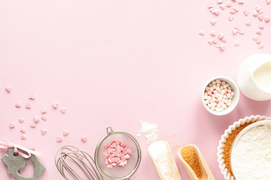 Frame of food ingredients for baking on a gently pink pastel background. Cooking flat lay with copy space. Top view. Baking concept. Valentine's Day. flat lay