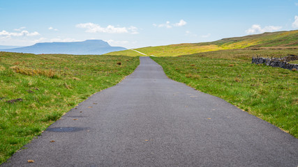 Rural road in the Yorkshire Dales near Oughtershaw, North Yorkshire, England, UK