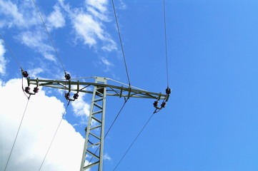 High voltage tower against blue sky with clouds, Rhineland Palatinate, Germany. high-tension...